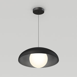 The Artika Boden LED modern mid-century pendant light 3 CCT features a round black shade and glowing white bulb, elegantly suspended by a thin black cord against a light gray background.
