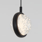 A modern pendant light with a black circular frame encasing a textured glass globe filled with bubbles, suspended from a black cord against a plain light gray background.
