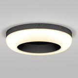 A modern, circular ceiling light with a black central disc and an illuminated white outer ring, mounted on a plain light-colored ceiling.