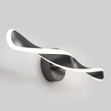 A modern wall light fixture with a twisted, ribbon-like design in black and white, emitting soft white light along its edges, mounted on a round base against a plain gray background.