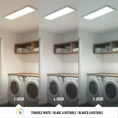 A laundry room with a washer and dryer is illuminated by the Artika Sunray ultra thin LED light panel 3 CCT, shown in three color temperatures—3000K (warm), 4000K (neutral), and 5000K (cool)—to demonstrate lighting differences.
