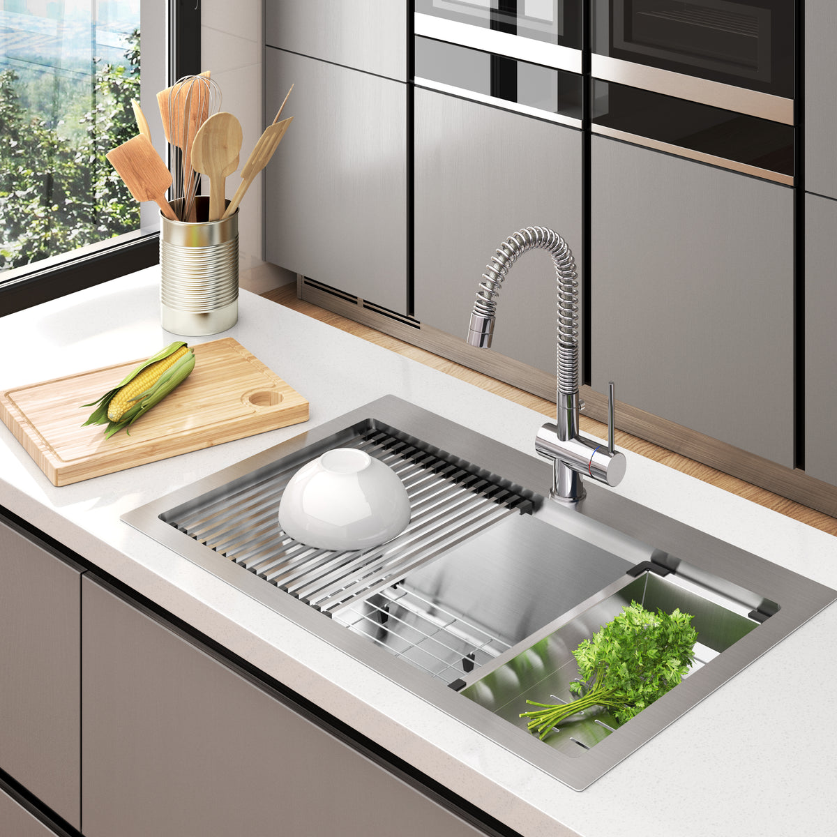 A modern kitchen sink with a flexible faucet, a white bowl on a drying rack, fresh greens in a basin, and a wooden cutting board with a corn cob next to a tin can holding kitchen utensils by a window.