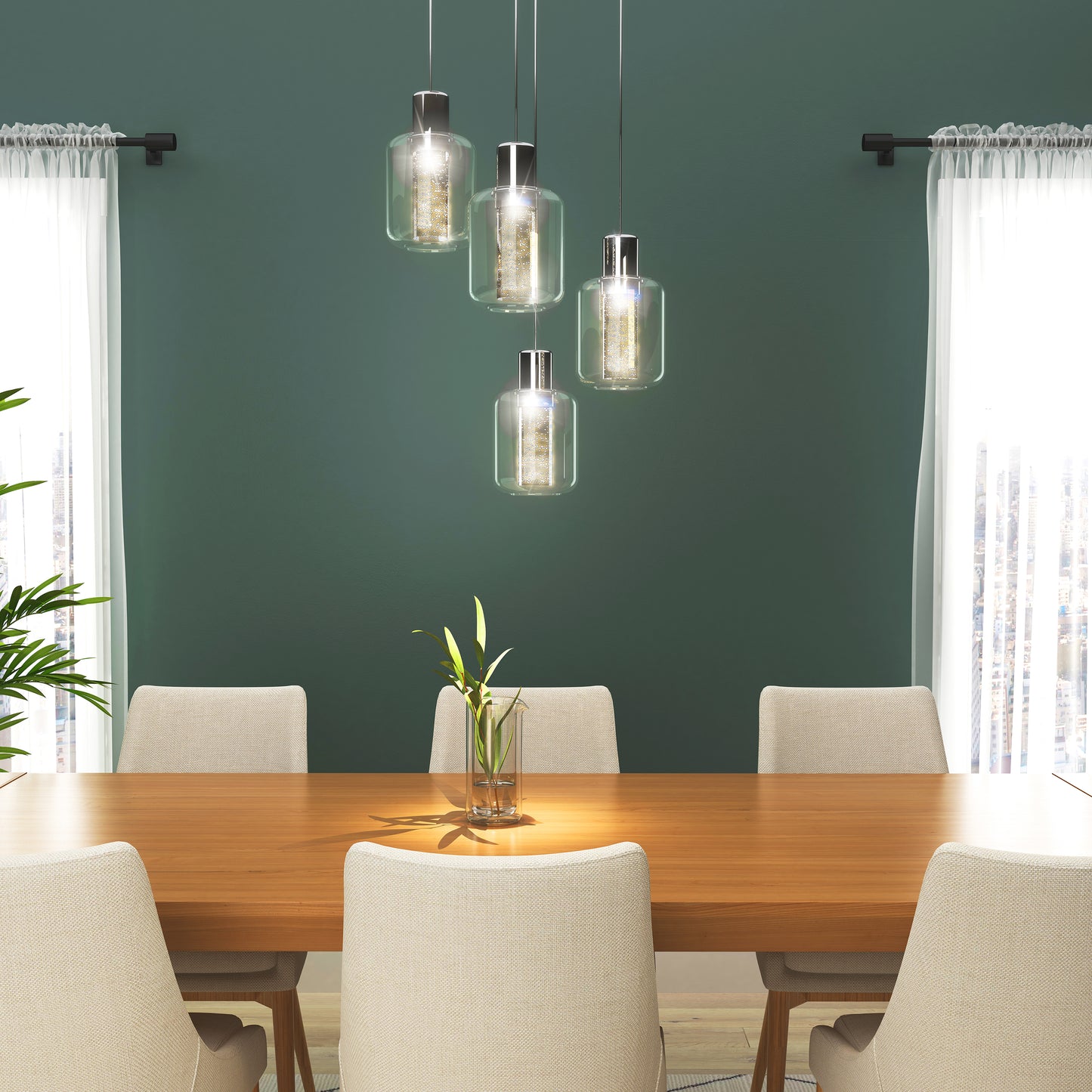 A modern dining room with a wooden table, six beige chairs, a glass vase with green stems, green walls, two windows with white curtains, and an Artika Champagne Globe 4-light LED pendant hanging above the table.