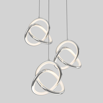 The Artika Zephyr 3-light LED pendant features three modern fixtures with intertwined metallic and illuminated loops, creating an abstract, contemporary look against a plain light gray background.