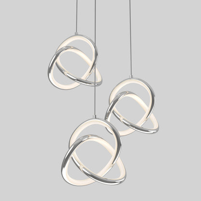 Three modern pendant lights with intertwined chrome and glowing white loops hang against a plain light gray background.