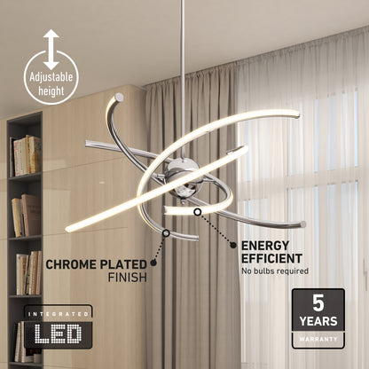 The Artika Silvio LED pendant light 3 CCT, a modern chrome fixture with curved bars, hangs by beige curtains and a bookshelf; it features adjustable height, energy efficiency, and comes with a 5-year warranty.