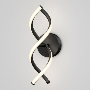 The Artika DNA modern LED wall sconce 3 CCT features two intertwined LED strips—one black, one illuminated—mounted on a round black base against a light gray wall.