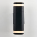 A modern black wall sconce with a cylindrical shape, featuring illuminated frosted bands at the top and bottom, mounted on a light-colored wall.