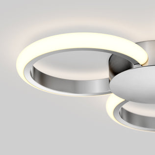 The Artika Nyala 15 in. LED flush mount light 5CCT features a circular metallic base and a glowing white LED ring, mounted on a white ceiling for a minimalistic, contemporary look.