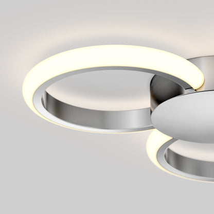 The Artika Nyala 15 in. LED flush mount light 5CCT features a circular metallic base and a glowing white LED ring, mounted on a white ceiling for a minimalistic, contemporary look.