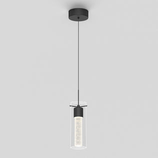 The Essence LED pendant light by Artika features a black ceiling mount, a cylindrical glass shade, and a slim black cord. The illuminated inner cylinder creates a sparkling effect for a modern look.