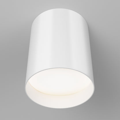 The Artika Radius LED flush mount light 3 CCT, in modern matte black, is shown turned on, casting a soft glow on a light gray ceiling. Its adjustable color temperature lets you create the perfect ambiance for any space.