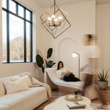 A modern, cozy living room with a woman reading on a curved chaise lounge, a blurred person walking by, soft beige furniture, large window, geometric chandelier, and potted plants. Warm natural light fills the space.