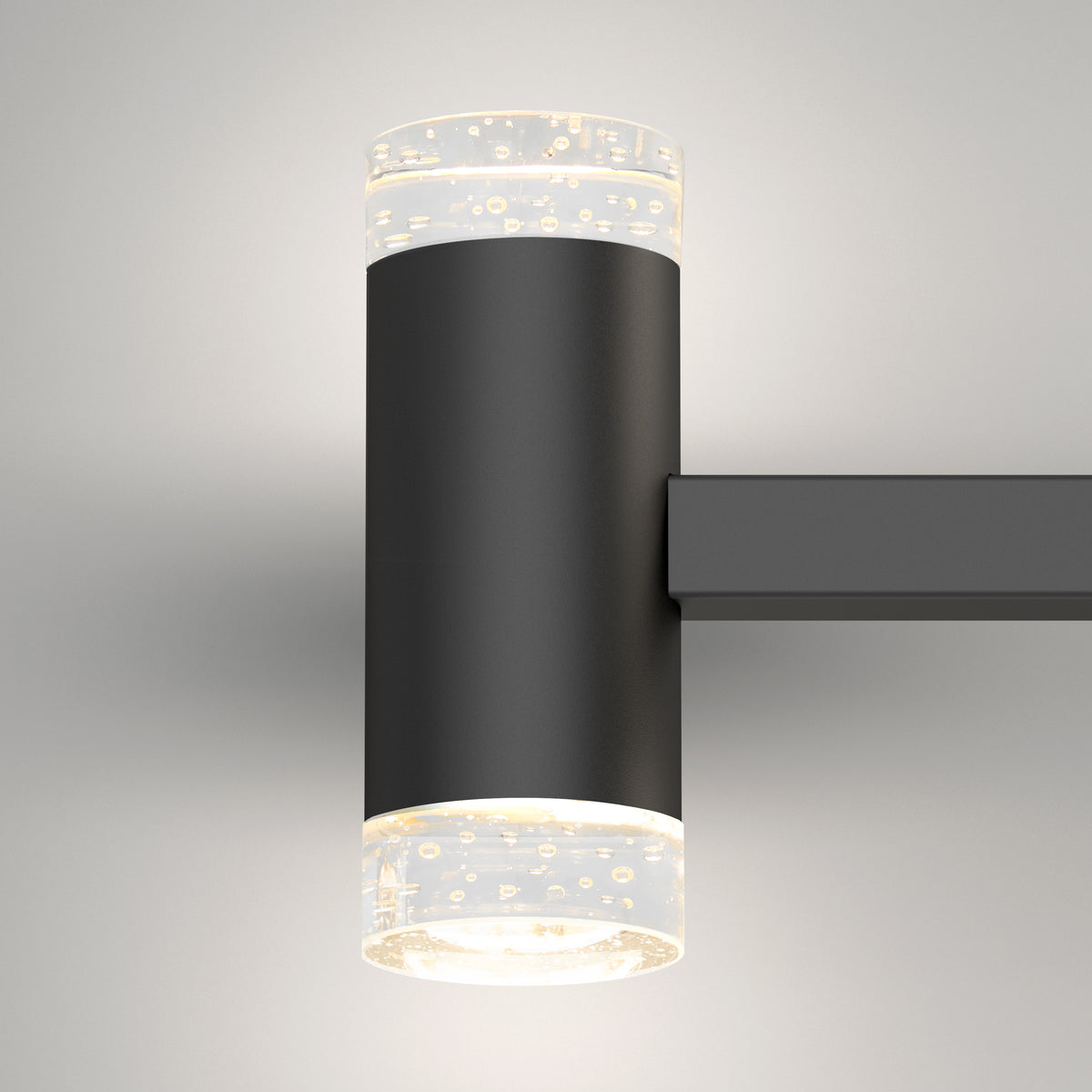 The Artika Mist 26-in (67 cm) Integrated LED 5-CCT Vanity Light Bar for Bathroom features a sleek matte black cylindrical design with transparent textured ends, casting soft white light up and down—perfect for bathroom lighting.