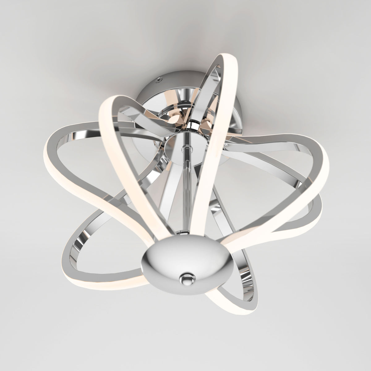 The Artika Meridian LED flush mount light features a chrome finish base and curved LED strips in an abstract, sculptural design, perfect for adding modern style to a white ceiling.
