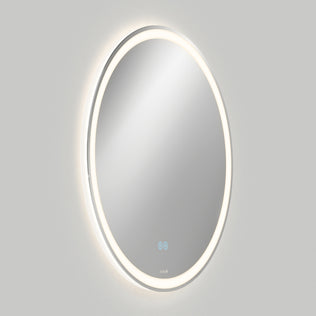 The Artika Ayla 28 in. LED mirror features a wall-mounted round design with an illuminated edge, defogger, and three CCT options. Two blue touch controls are at the bottom, set against a plain light gray background.