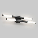 Modern wall sconce with two horizontal, parallel black bars, each featuring cylindrical white light tubes at both ends, mounted on a round black base against a light gray background.