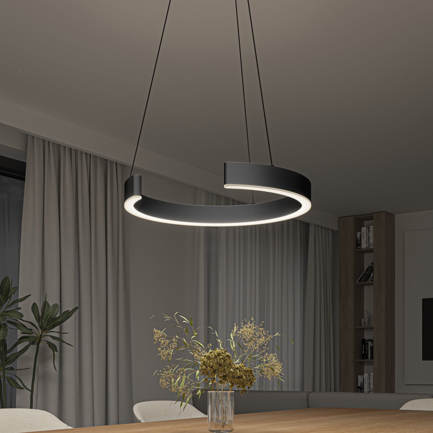 A modern dining room features a simple design with the Vance modern LED pendant light 3 CCT by Artika-CAN-dev above a wooden table, accented by a glass vase of dried flowers, neutral curtains, and a tall plant.