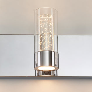 Artika Essence 27-in LED vanity light features a modern chrome base and glass shade—ideal for mounting above bathroom mirrors.