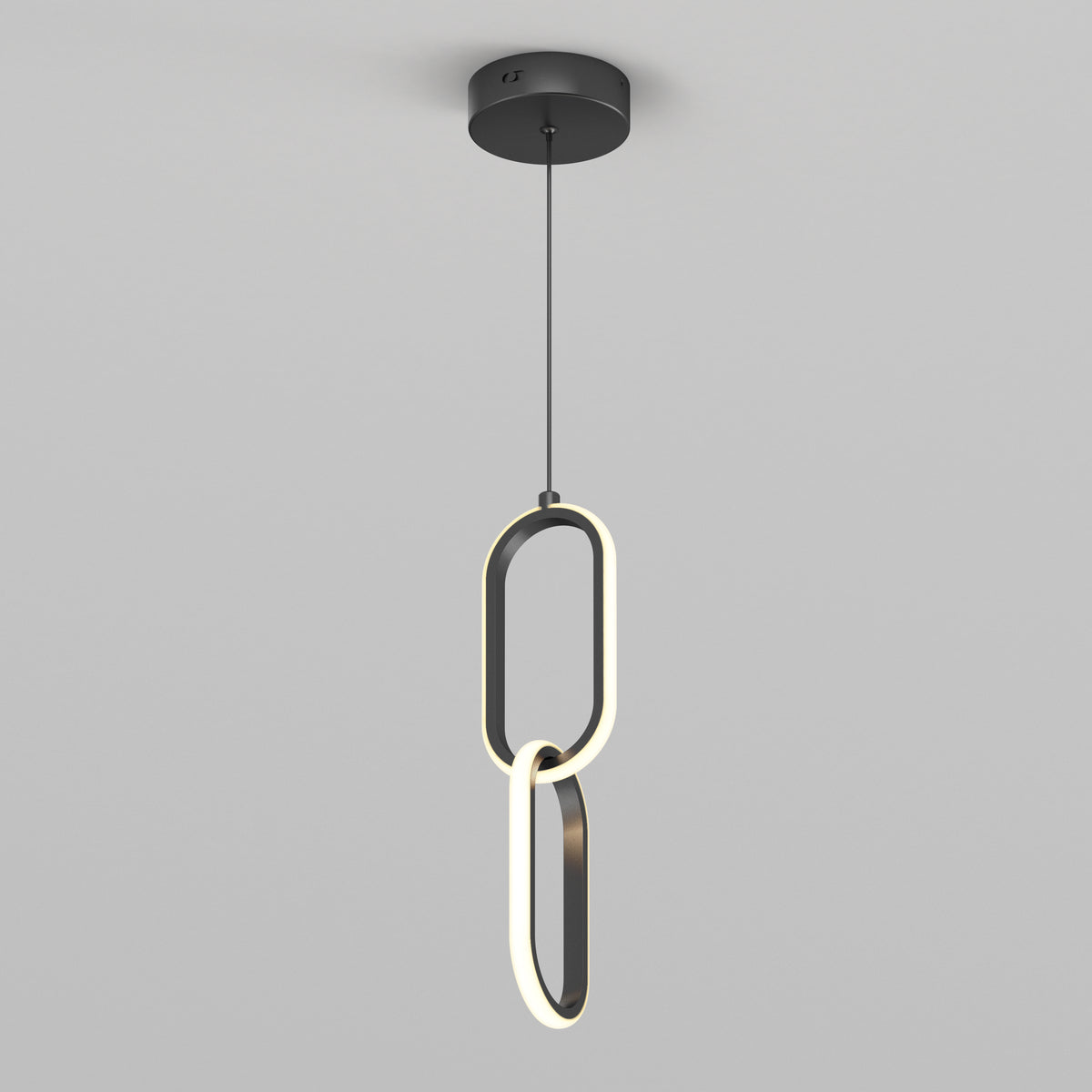 The Artika Catena LED pendant light features two interlocking oval LED rings, suspended by a black cord from a round black ceiling mount, shown against a plain gray background.