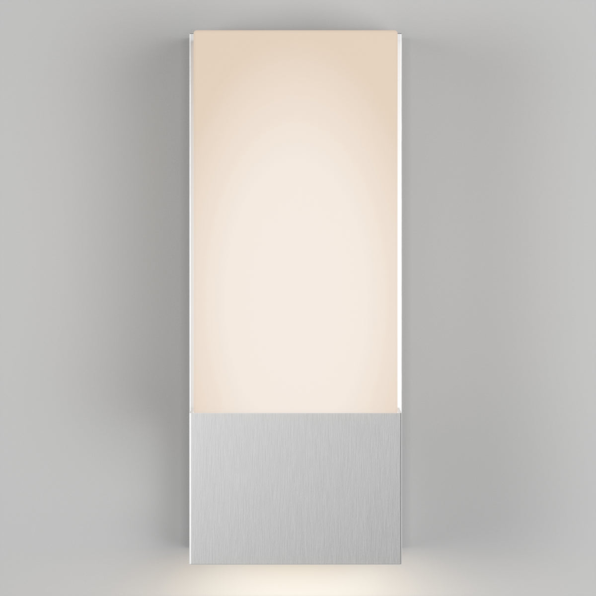 The Artika Dixon indoor-outdoor LED wall light features a rectangular frosted panel atop a brushed metal base and, when mounted on a light gray wall, emits a soft, warm glow.