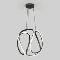 The Artika Vivaldi Big LED pendant light features a black, abstract curved frame with integrated LED strips (5 CCT), suspended by three thin wires against a plain light gray background.