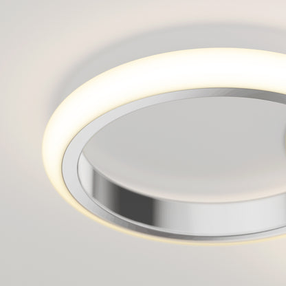 The Artika Nyala 15 in. LED flush mount light 5CCT is a modern circular ceiling fixture with a glowing white ring and reflective metallic center, designed for smooth white ceilings.