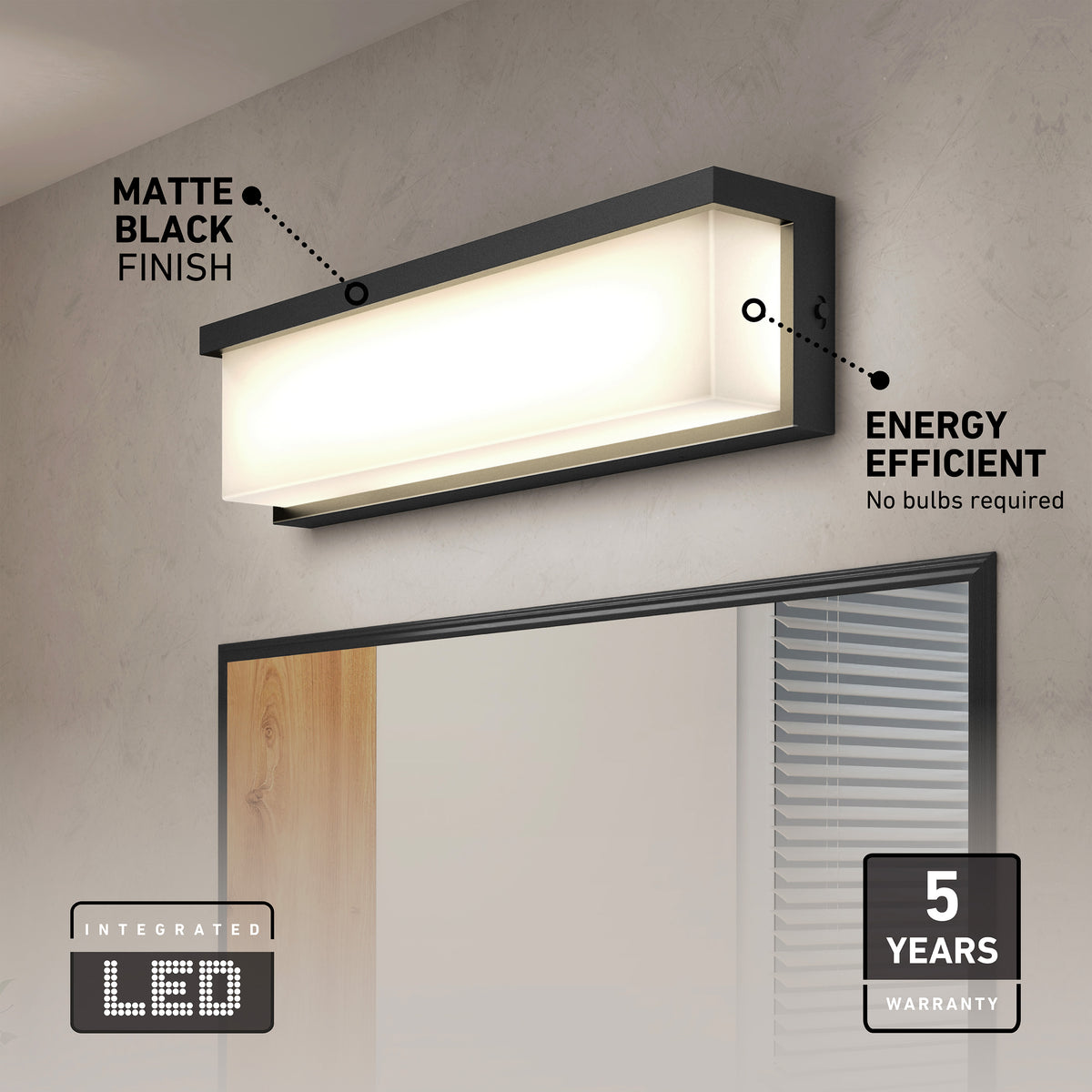 A modern rectangular wall light with a matte black finish is mounted above a mirror. Text highlights its energy efficiency, integrated LED, and 5-year warranty. No light bulbs are required.
