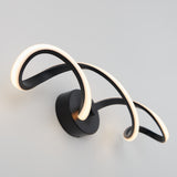 A modern wall light with two curved, looping LED strips attached to a black circular base, mounted on a white wall. The design is minimalist and artistic, emitting a soft, warm glow.