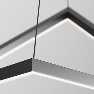 Close-up of the Artika Artemis LED pendant light 3 CCT, featuring a modern geometric design with a black frame and integrated LED strip, suspended by thin wires against a white or light gray ceiling.