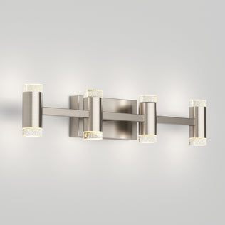The Artika Mist modern LED bathroom vanity light 5 CCT features four cylindrical lights with a brushed nickel finish and clear, textured end caps, providing adjustable colour balance and stylish illumination for your bathroom.