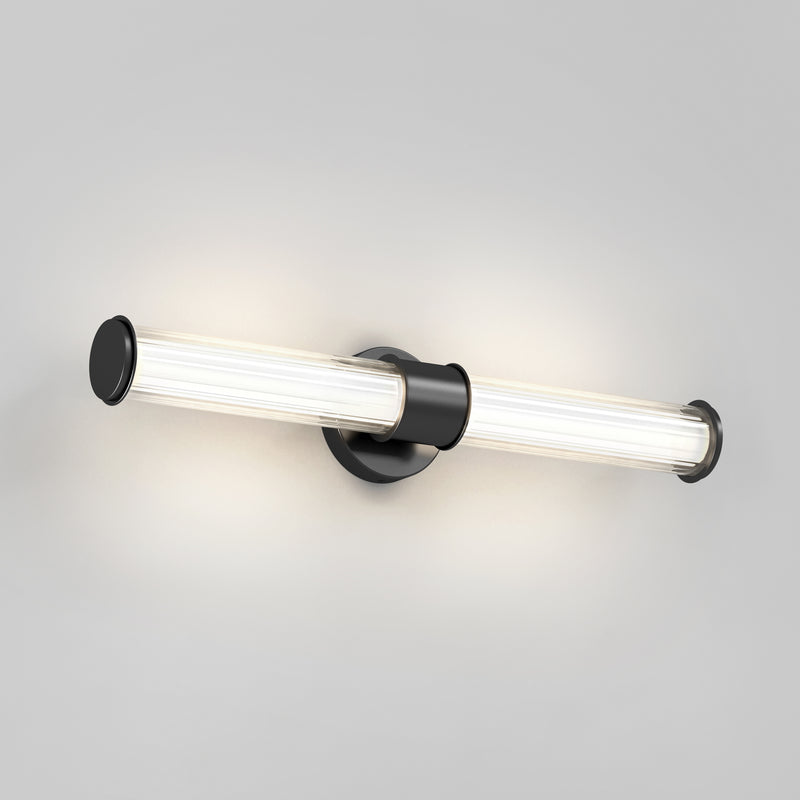 The Artika Kendra LED contemporary bathroom vanity light 3 CCT features a modern tubular design with a matte black circular base and two horizontal LED bulbs, providing soft white light for your space.