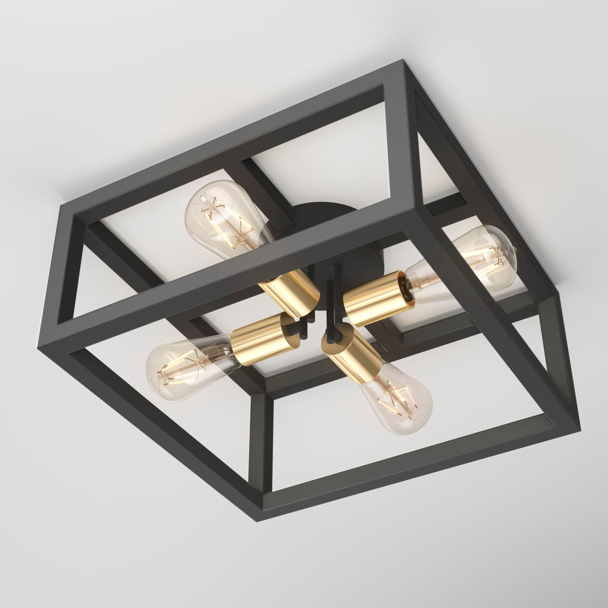 A modern ceiling light fixture with a black geometric metal frame, four exposed bulbs, and gold central accents, mounted flush against a white ceiling.