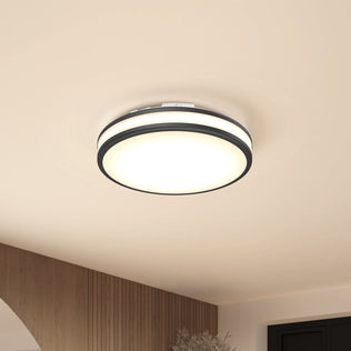 The Artika Hemisphere 15″ LED ceiling light with 5 CCT brightens a beige room with wood and dark trim accents.