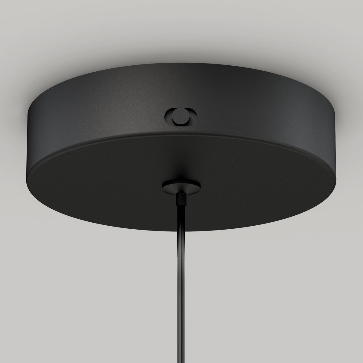 A close-up of the Artika Hanson 1-light LED pendant 5 CCT shows its black, round ceiling canopy with a single cord descending from the center, set against a plain light gray background.