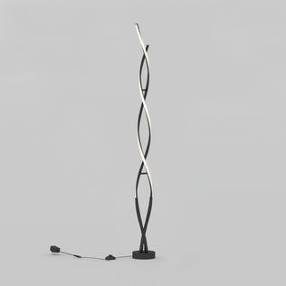 The Artika Swirl modern LED floor lamp features two intertwined wavy light strips on a circular black base, with the power cord and plug visible on the left side against a plain light gray background.