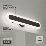 Rectangular LED wall light with matte black finish, glowing edges, and streamlined design. Text highlights energy efficiency, steel build, three-year warranty, and no bulbs required. The light is mounted on a wall above a mirror.