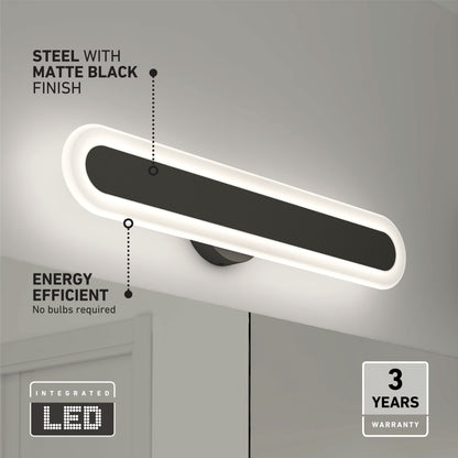 The Artika Pista modern LED bathroom vanity light 5 CCT, in matte black steel, is mounted above the mirror. It features integrated LED technology for energy efficiency, a three-year warranty, and softly glows around the fixture.