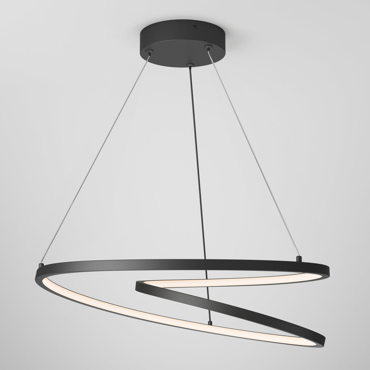 The Artika Salto LED pendant light features two intertwined spiral black rings suspended by three wires from a round black ceiling mount, emitting soft white light from the inner edge.