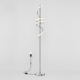 The Artika Coda modern LED floor lamp 5CCT features a spiral design, dimmable lighting, and stands on a round base with a visible black cord and switch, shown plugged in against a plain white background.