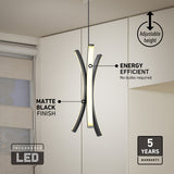 Modern pendant light with curved, matte black LED bars hangs in a minimal kitchen. Labels highlight adjustable height, energy efficiency, matte black finish, 5-year warranty, and no bulbs required.