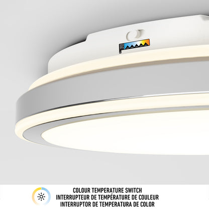 A close-up of the Artika Altitude 15 in. LED modern flush mount light 5 CCT, showing its adjustable colour temperature slider above a multicolored scale. Text below says "COLOUR TEMPERATURE SWITCH" in English, French, and Spanish.
