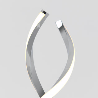 The Artika Swirl LED table lamp features two metallic, curved strips with glowing edges that twist upward against a light gray background, forming an abstract, modern, and minimalistic design.