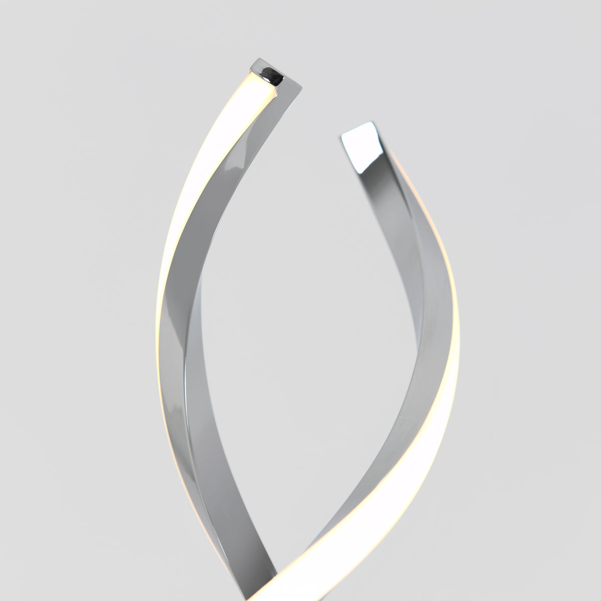 A modern lamp with two curved, metallic arms featuring integrated LED light strips, twisting upward in a spiral shape against a plain grey background.