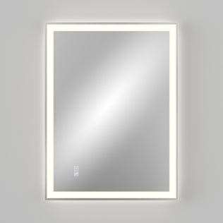 The Artika Sofia LED mirror 3 CCT with defogger features a rectangular design, an illuminated LED border, and two touch control buttons in the lower left corner, all set against a plain light gray background.