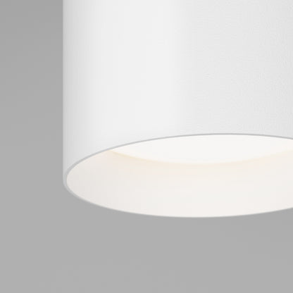 Minimalist close-up of the Artika Radius LED flush mount light 3 CCT, softly illuminated against a plain light gray background. Adjustable color-balance lets you customize your room’s ambiance.