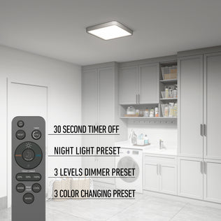 A laundry room with grey cabinets, washer, dryer, and an Artika Europa 18 in. LED flush mount light—features 30-sec timer off, night light, 3 dimmer levels, and 3 color presets. The remote control is shown on the left.