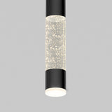 A modern cylindrical ceiling light with black ends and a central section filled with illuminated bubbles, set against a plain gray background.