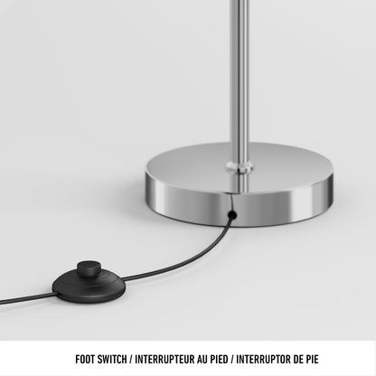 A close-up of the Coda modern LED floor lamp 5CCT by Artika shows its chrome base with a black foot switch connected via a thin cable. The text below reads: Foot Switch / Interrupteur au pied / Interruptor de pie.