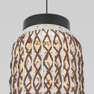 Close-up of the Artika Benson Mini LED pendant light 5 CCT, featuring a woven rattan design with brown and white strands, black top, glowing bulb, and adjustable color temperature for a cozy ambiance against a light gray background.